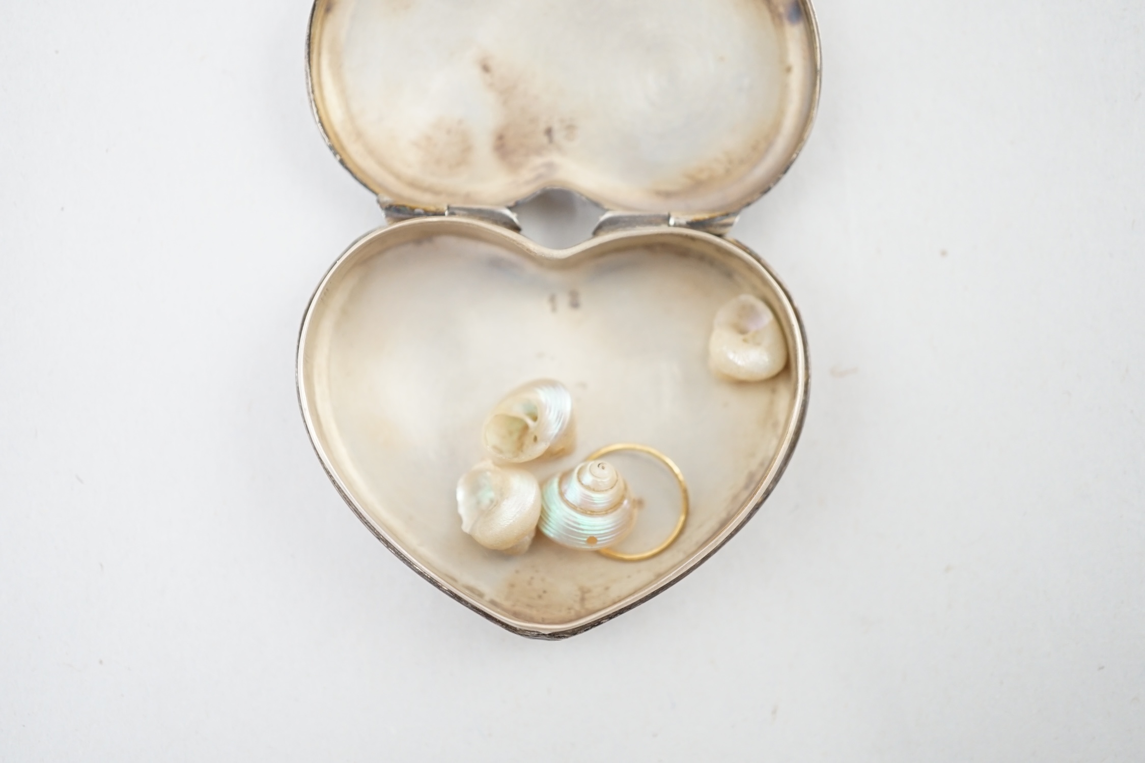 A modern Cartier sterling silver and polychrome enamel heart shaped pill box